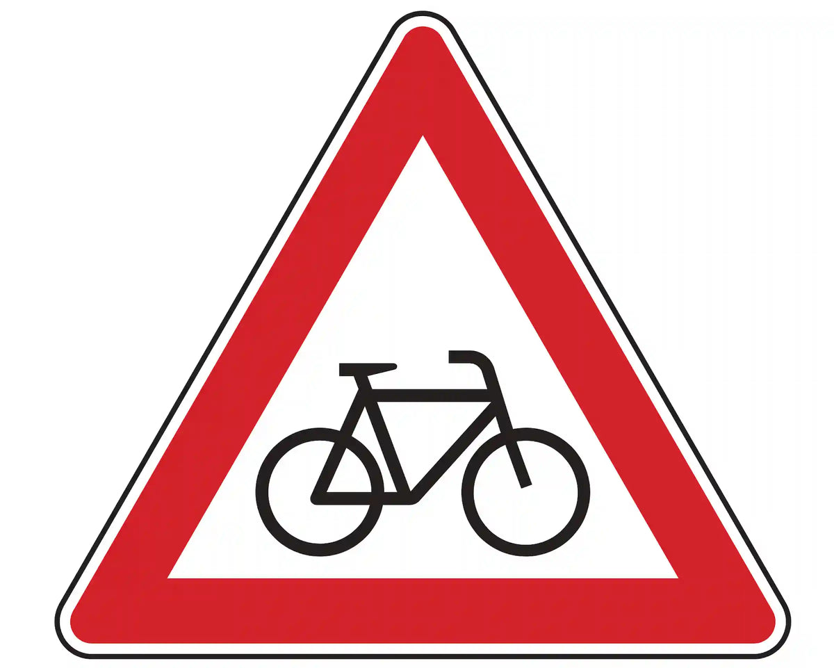 Warnschild 138-20: rotes Dreieck mit Fahrrad­symbol; steht links und weist auf Stellen hin, an denen Radfahrer häufig und plötzlich die Fahrbahn kreuzen.